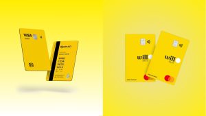 Cartões amarelos do Nomad e do Will Bank posicionados lado a lado sobre fundo amarelo. O cartão da Nomad exibe a bandeira Visa e design vertical, enquanto os do Will Bank têm bandeira Mastercard e visual vibrante.